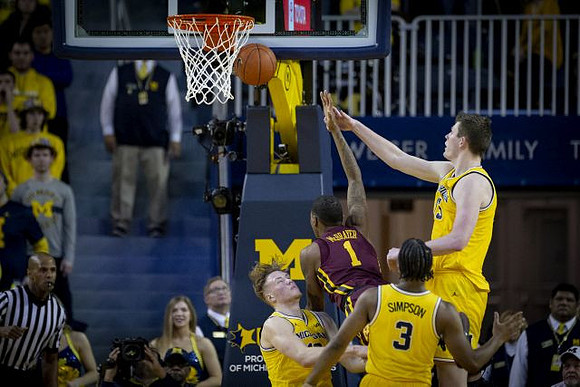 Ignas Brazdeikis (13), Zavier Simpson (3), and Jon Teske (15)