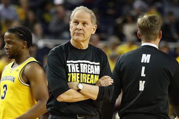 Zavier Simpson (3), John Beilein, and Luke Yaklich