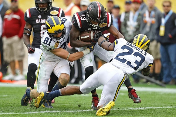 Nate Schoenle (81) and O'Maury Samuels (23)