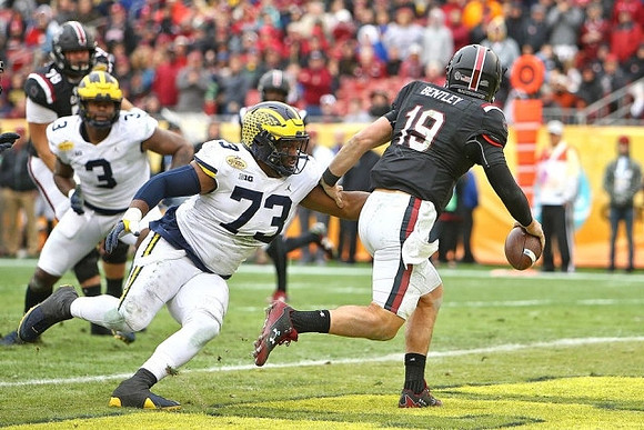 Rashan Gary (3) and Maurice Hurst (73)
