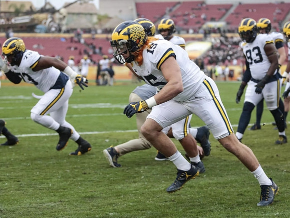 Maurice Hurst (73), Chase Winovich (15), and Lawrence Marshall (93)