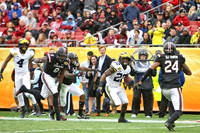 Nico Collins (4) and Karan Higdon (22)