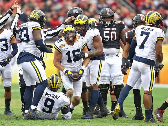 Lawrence Marshall (93), Mike McCray (9), Chase Winovich (15), Rashan Gary (3), and Khaleke Hudson (7)