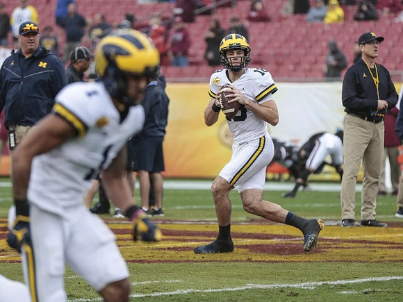 Greg Frey, Kekoa Crawford (1), Brandon Peters (18), and Jim Harbaugh