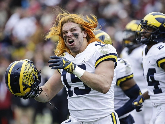 Chase Winovich (15) and Lavert Hill (24)