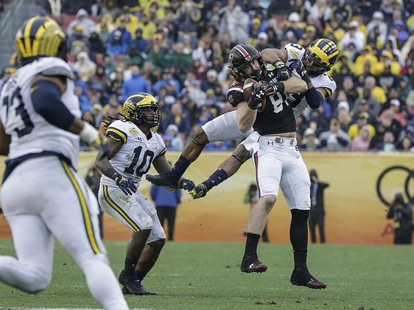 Maurice Hurst (73), Devin Bush (10), and Tyree Kinnel (23)