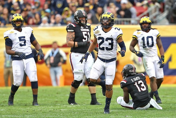 Aubrey Solomon (5), Tyree Kinnel (23), and Devin Bush (10)