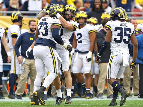 Maurice Hurst (73) and Josh Uche (35)