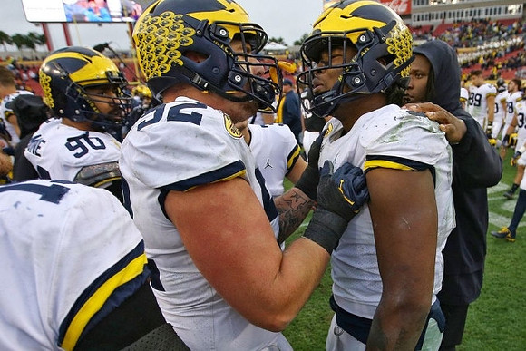 Bryan Mone (90), Mason Cole (52), and Rashan Gary (3)