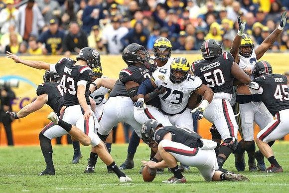 Maurice Hurst (73) and Rashan Gary (3)
