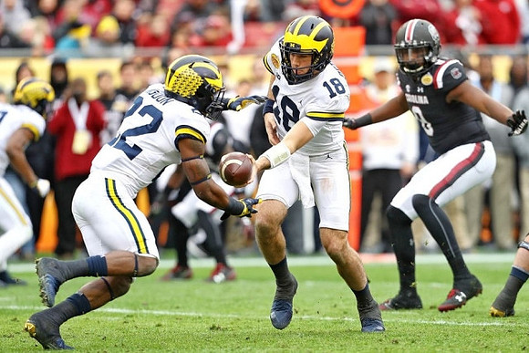 Karan Higdon (22) and Brandon Peters (18)