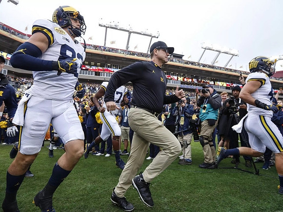 Zach Gentry (83) and Jim Harbaugh