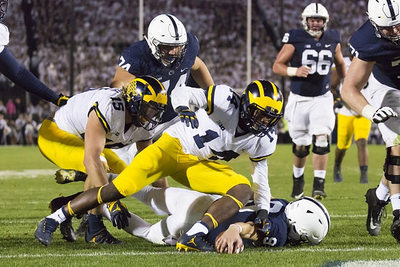 Chase Winovich (15) and Josh Metellus (14)