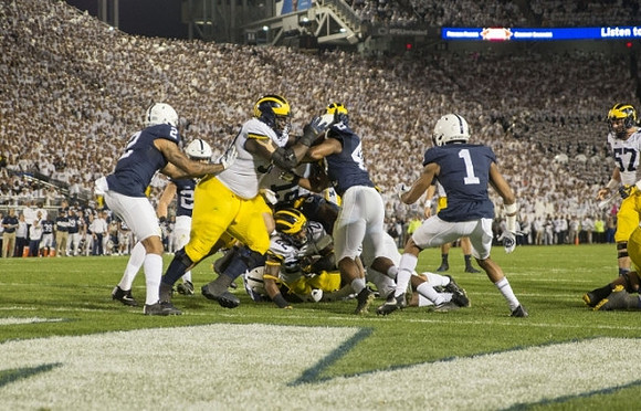 Michael Onwenu (50), Henry Poggi (19), Karan Higdon (22), and Patrick Kugler (57)