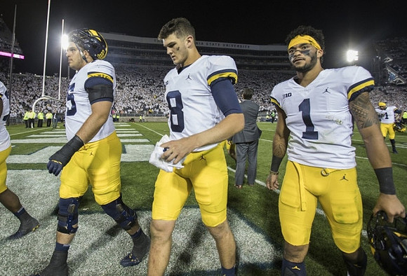 Jon Runyan Jr. (75), John O'Korn (8), and Kekoa Crawford (1)
