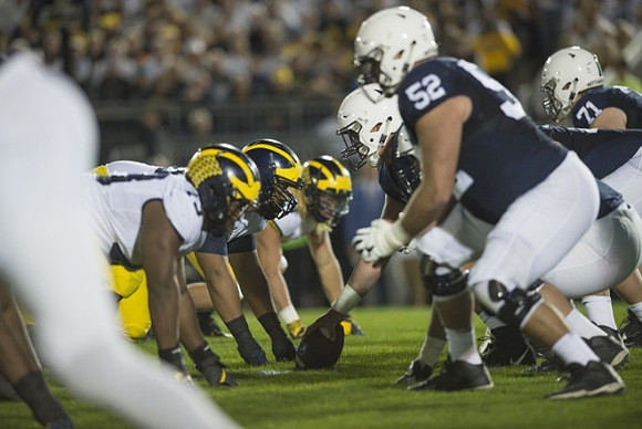 Maurice Hurst (73) and Chase Winovich (15)