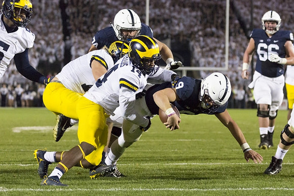 Chase Winovich (15) and Josh Metellus (14)