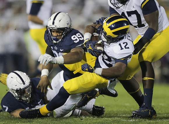 Chris Evans (12) and Tyrone Wheatley Jr. (17)