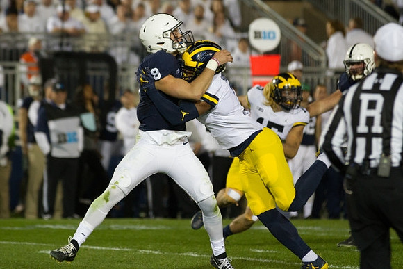 Khaleke Hudson (7) and Chase Winovich (15)