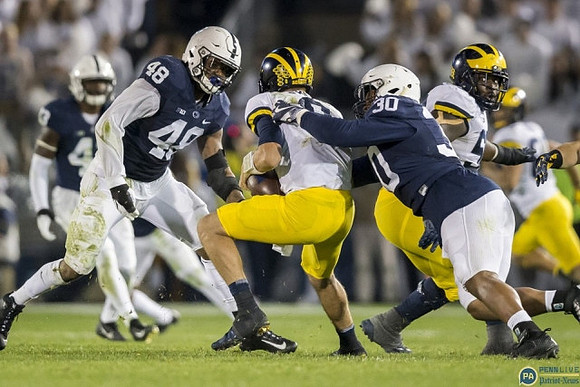 John O'Korn (8) and Michael Onwenu (50)