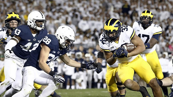 Ty Isaac (32) and Tyrone Wheatley Jr. (17)
