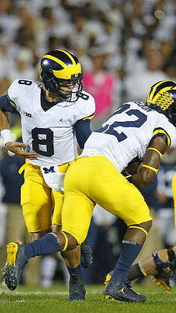 John O'Korn (8) and Karan Higdon (22)