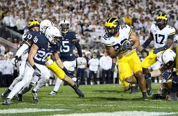 Ty Isaac (32) and Tyrone Wheatley Jr. (17)