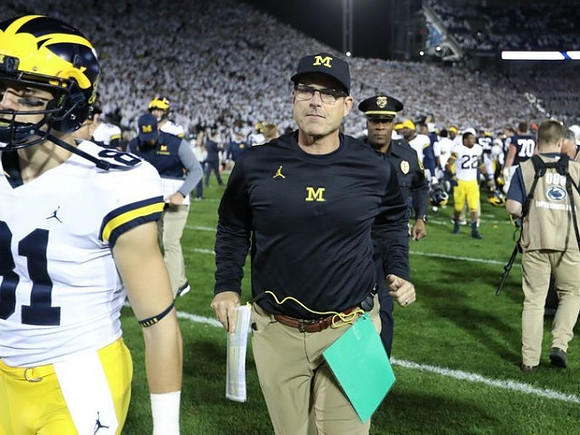 Nate Schoenle (81) and Jim Harbaugh