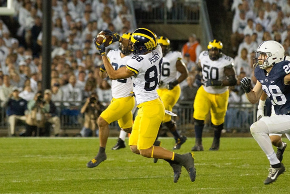 Ty Isaac (32), Grant Perry (88), Juwann Bushell-Beatty (76), and Michael Onwenu (50)