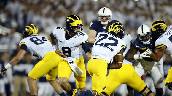 Sean McKeon (84), John O'Korn (8), Karan Higdon (22), and Patrick Kugler (57)