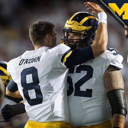 John O'Korn (8) and Mason Cole (52)