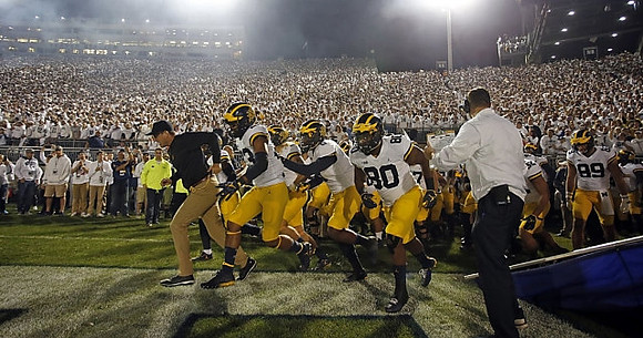 Jim Harbaugh, Rashan Gary (3), Khalid Hill (80), and Ian Bunting (89)