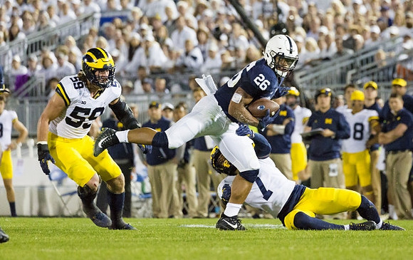 Noah Furbush (59) and Khaleke Hudson (7)