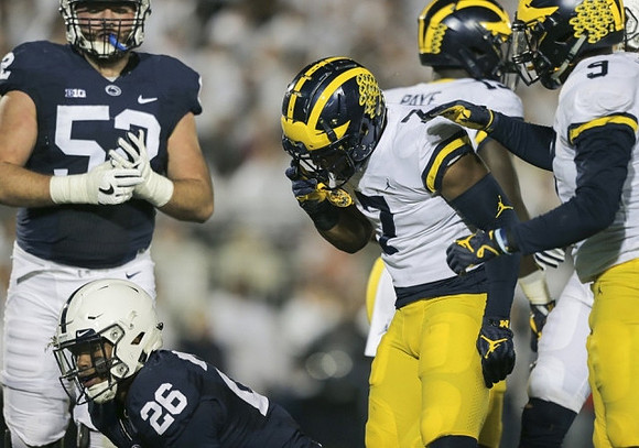 Khaleke Hudson (7), Kwity Paye (19), and Mike McCray (9)