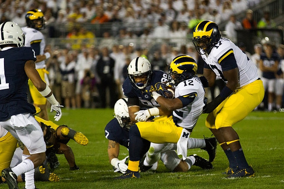 Chris Evans (12) and Tyrone Wheatley Jr. (17)