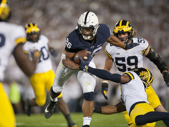 Noah Furbush (59) and Khaleke Hudson (7)