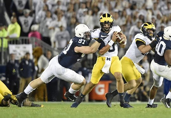 John O'Korn (8) and Jon Runyan Jr. (75)