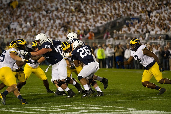 Chase Winovich (15) and Rashan Gary (3)
