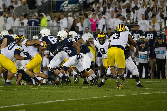 Bryan Mone (90), Chase Winovich (15), Mike McCray (9), and Rashan Gary (3)
