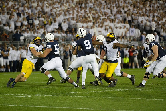 Chase Winovich (15), Rashan Gary (3), and Mike McCray (9)
