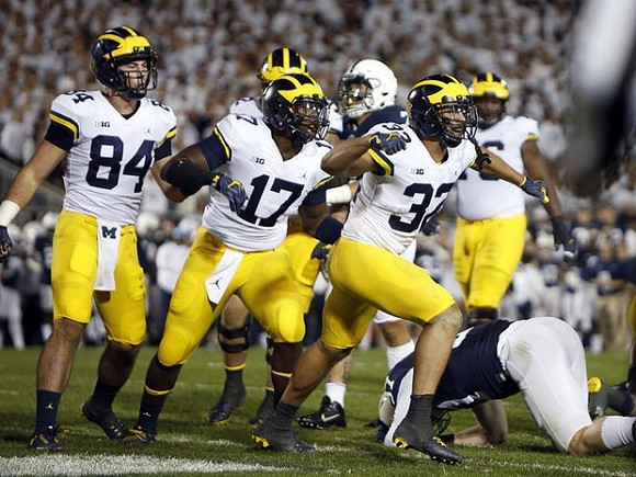 Sean McKeon (84), Tyrone Wheatley Jr. (17), and Ty Isaac (32)