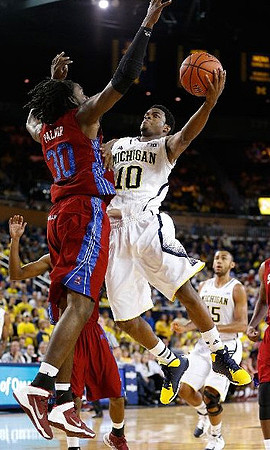 Derrick Walton Jr. (10) and Jon Horford (15)