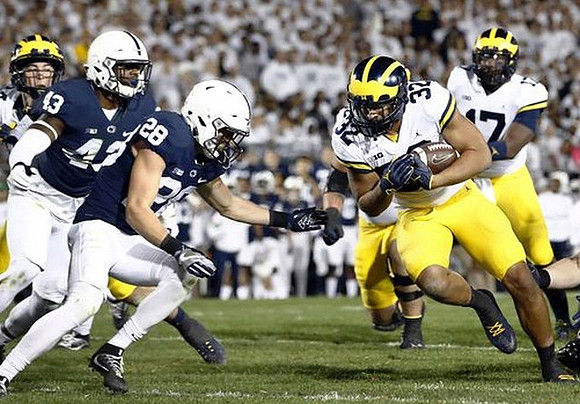 Ty Isaac (32) and Tyrone Wheatley Jr. (17)