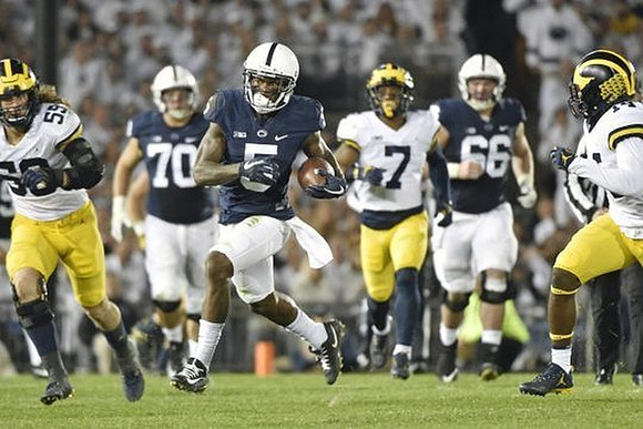 Noah Furbush (59), Khaleke Hudson (7), and Josh Metellus (14)
