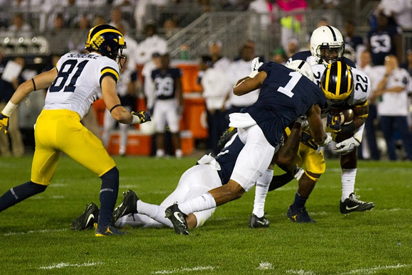 Nate Schoenle (81) and Karan Higdon (22)