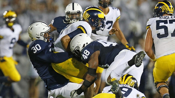 Donovan Peoples-Jones (9), John O'Korn (8), Henry Poggi (19), Ty Isaac (32), and Patrick Kugler (57)