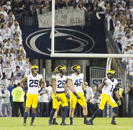 Benjamin St-Juste (25), J'Marick Woods (26), Michael Wroblewski (46), and Ambry Thomas (1)