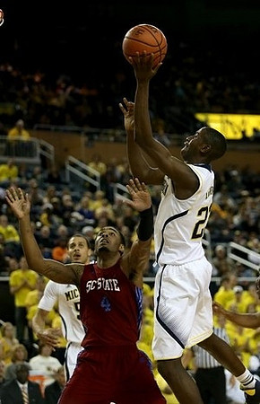 Caris LeVert (23) and Jordan Morgan (52)