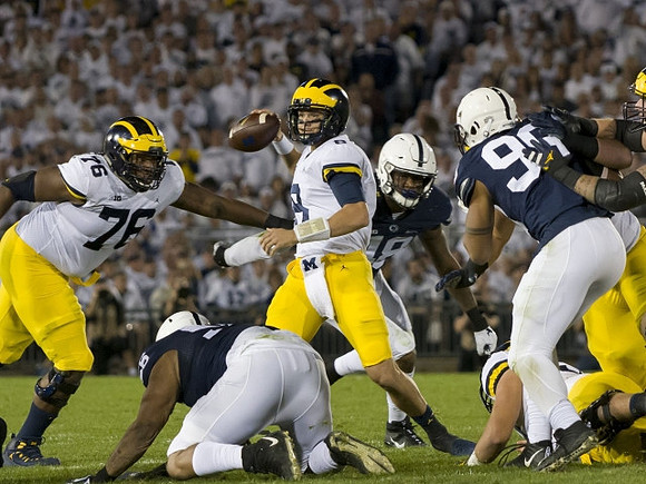 Juwann Bushell-Beatty (76) and John O'Korn (8)