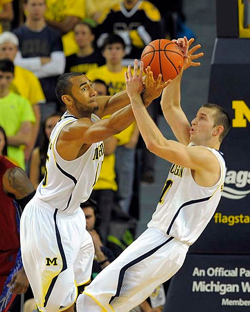 Jon Horford (15) and Nik Stauskas (11)